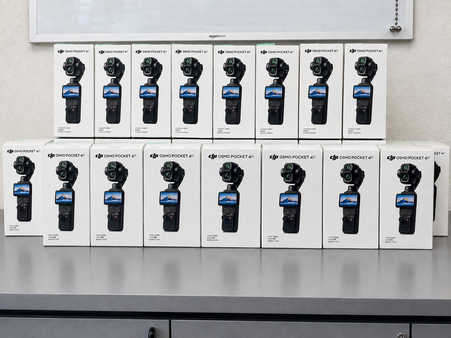 DJI Osmo Pocket 4P Standard Combo and Vlog Combo boxes stacked on the counter at Filmgear Canada in Vancouver